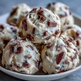 A mixing bowl of Greek Yogurt Cookie Dough highlights buttery sweetness and tangy yogurt with chocolate chips.