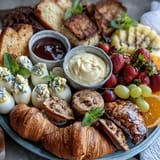 Easter Brunch Board with Deviled Eggs, Fruit, and Pastries, featuring classic deviled eggs, fresh seasonal fruit, and flaky pastries for a colorful and festive spread.