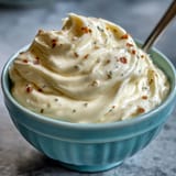 Rich, velvety aioli sauce made with egg yolk and garlic, ideal for seafood, roasted vegetables, or gourmet burgers.  