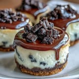 Creamy mini cheesecake bites on a crunchy Oreo crust, perfect for parties.