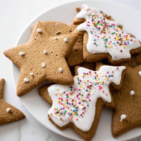 Deliciously spiced, freshly baked gingerbread cookies with a soft interior and gentle crunch, perfect treats.