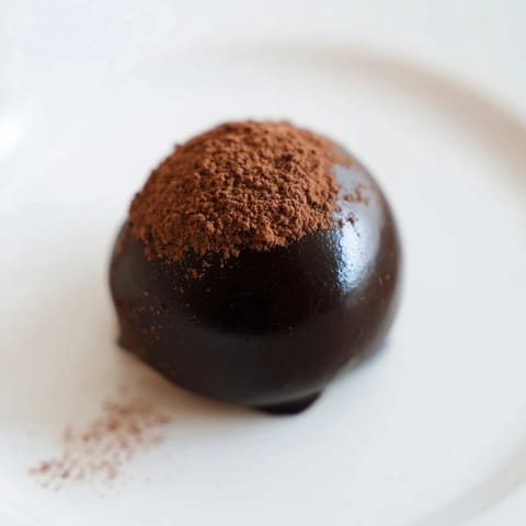 These decadent chocolate truffles, coated in colorful sprinkles, offer a rich, melt-in-your-mouth experience.