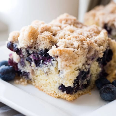 Fresh blueberries burst within this delicious blueberry buckle, baked to a perfect golden brown color.