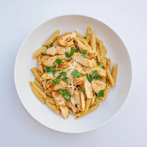 The Honey Chipotle Chicken Pasta is ready to serve, with a rich sauce clinging to the noodles and tender chicken pieces for a comforting meal.