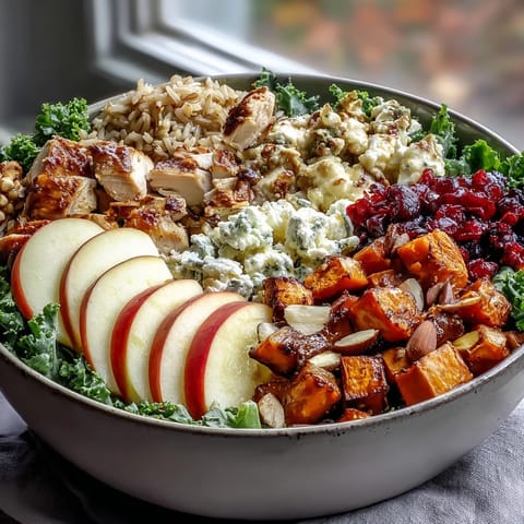 Nutritious and vibrant Harvest Bowl filled with roasted sweet potatoes, tender chicken, crisp apples, and tangy balsamic dressing.  