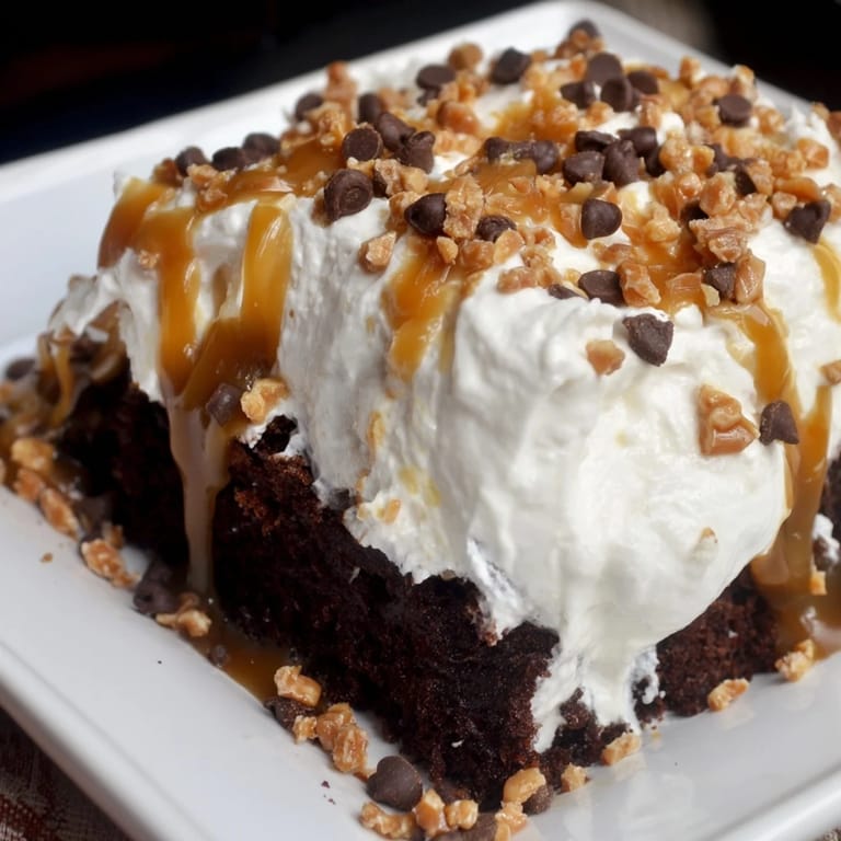 Imagine a slice: Better Than Sex Cake with toffee bits, offering a sweet, rich dessert.