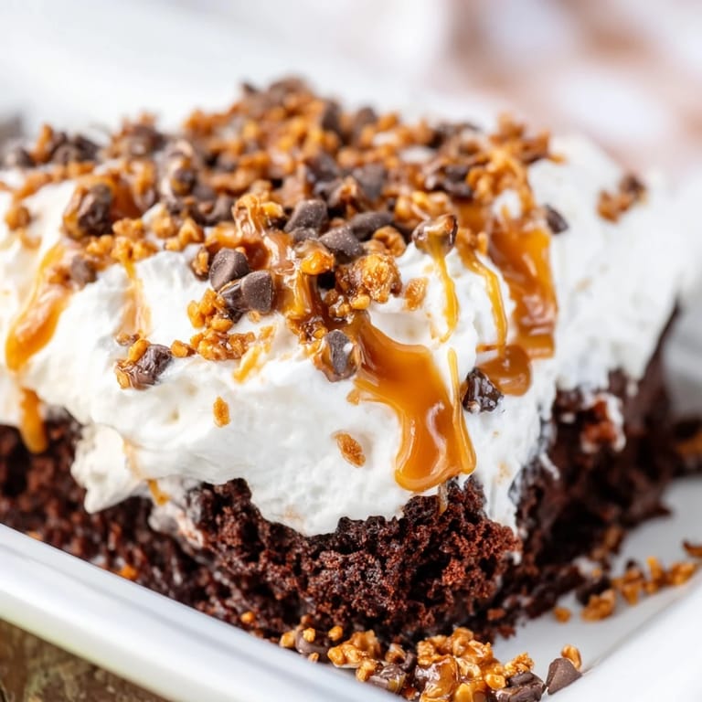 Golden caramel drips over the moist, hole-poked Better Than Sex Cake in this photo.