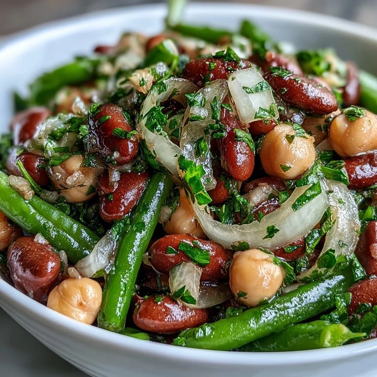 Colorful Three-Bean Salad, ready to serve at your next potluck gathering.
